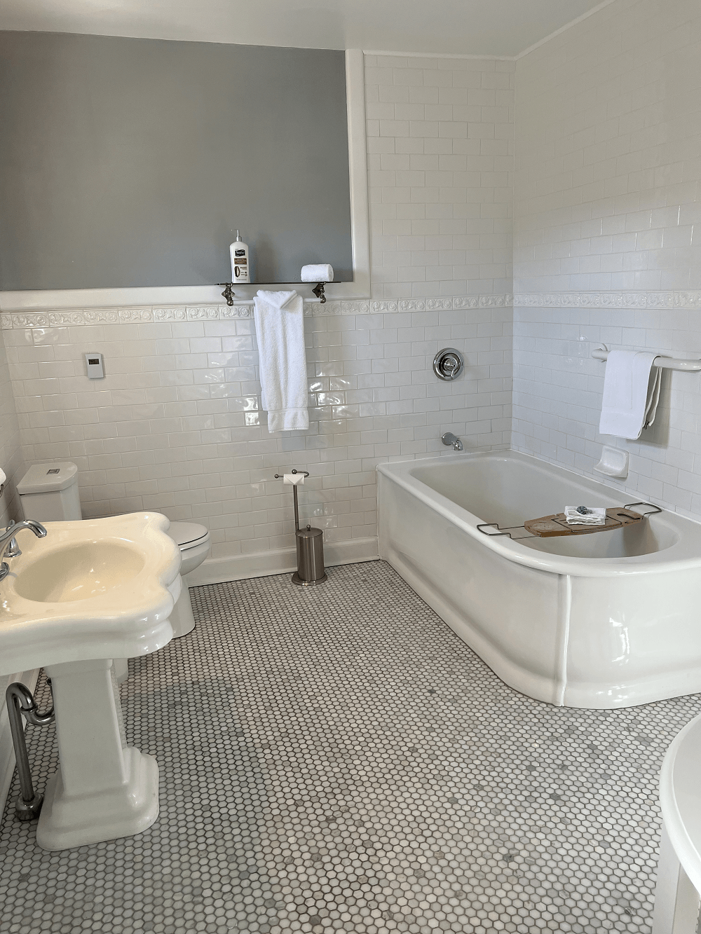 Ensuite bath with a large soaking tub, separate shower, and heated floors