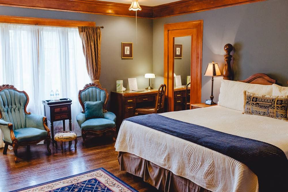 A lovely desk area tucked nicely in the corner next to the bed