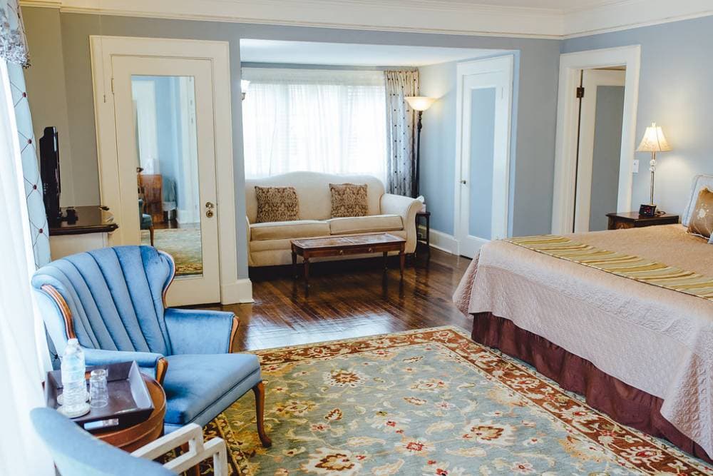 Sofa tucked into a nook with a large window, perfect spot to relax and read