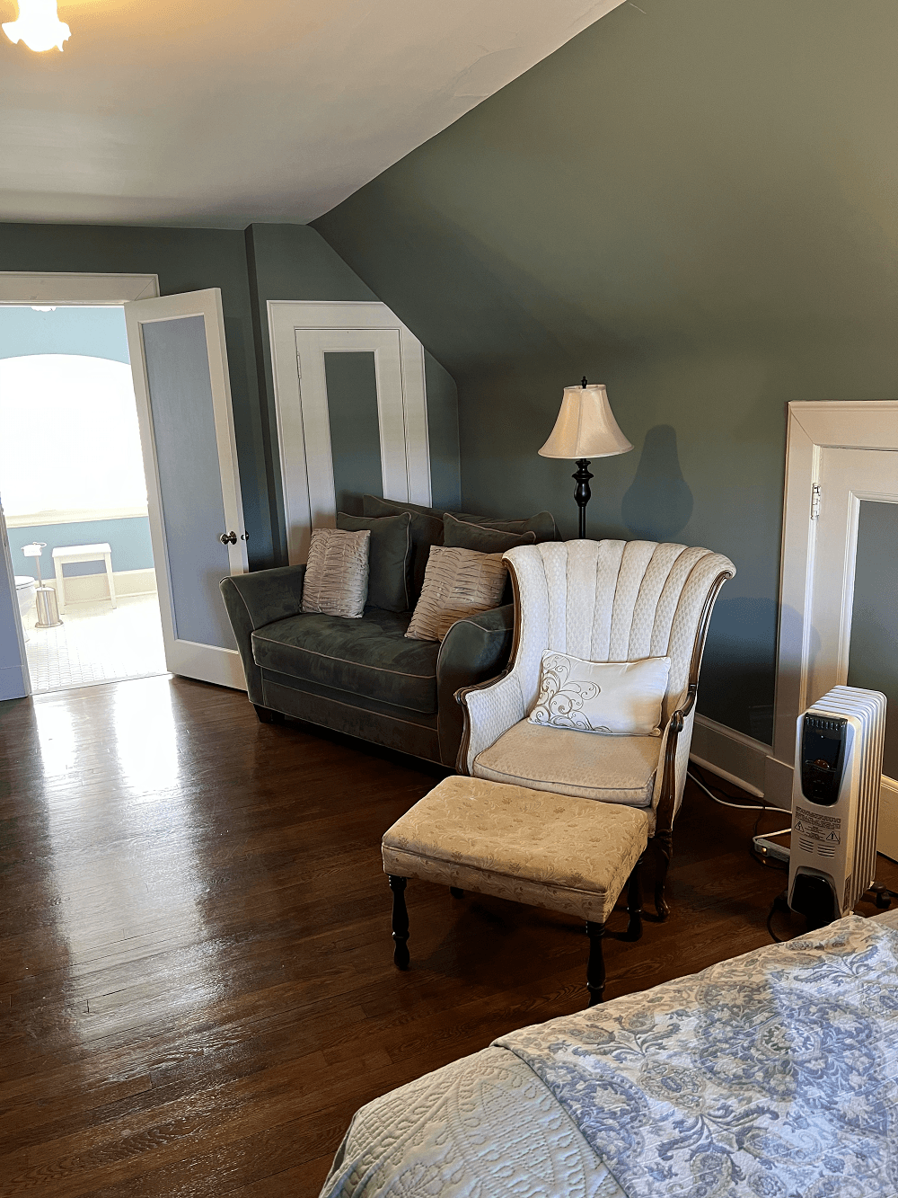 Ample sitting area in this large 3rd floor room between the bed and bath