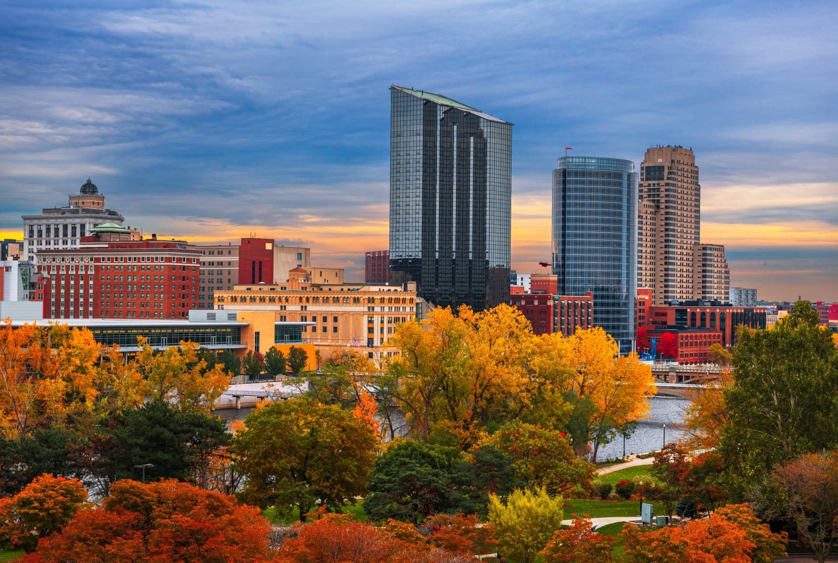 View of downtown Grand Rapids with Fall trees in the foreground